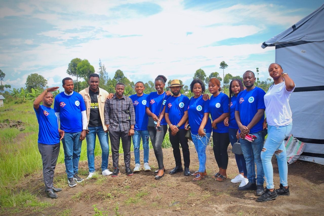 A photo of members of Congo Peace Academy standing together smiling