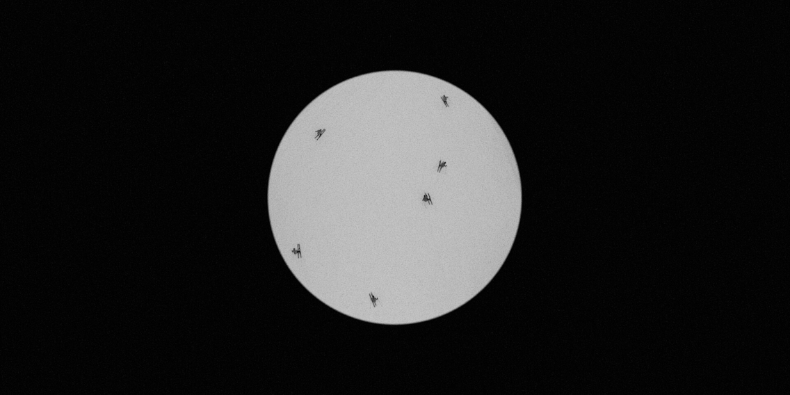 A moon with skiers on the moon.