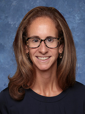 headshot of Meg Roach Booth in dark crewneck sweater