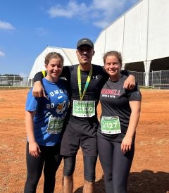 Three students smiling after a run
