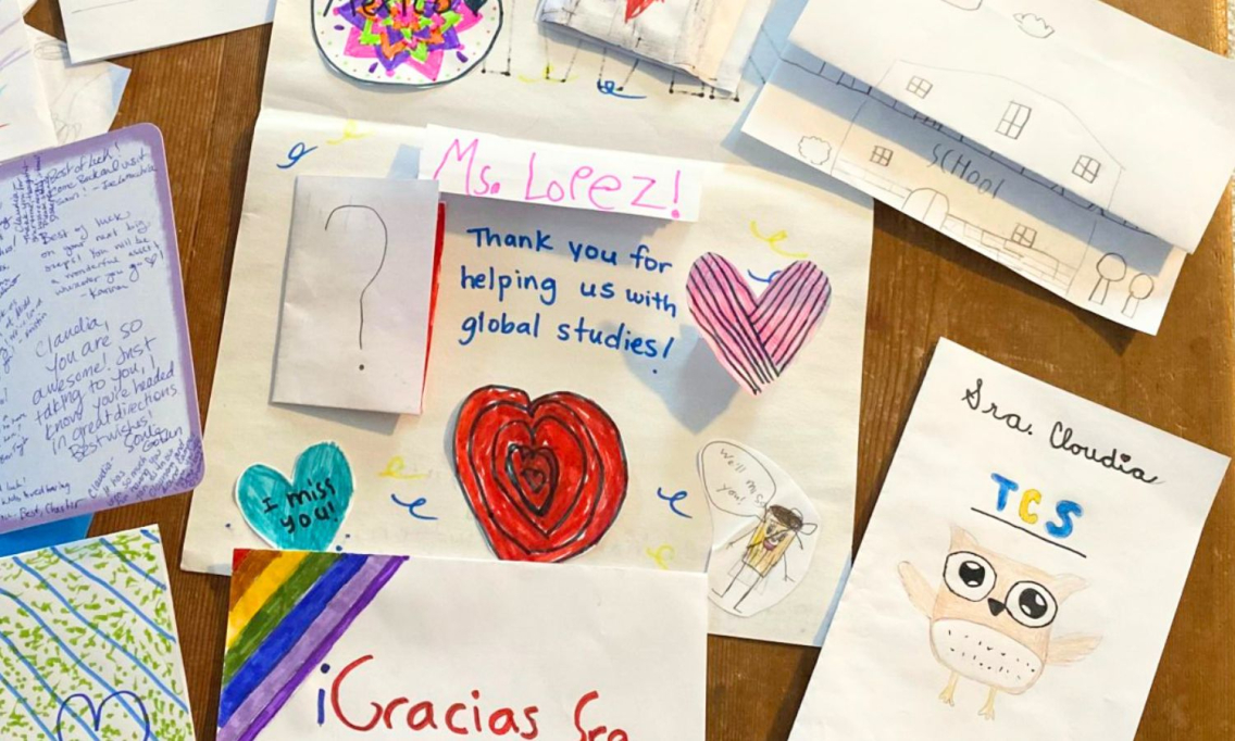 A photo of a table full of hand-drawn thank you cards given to Claudia.