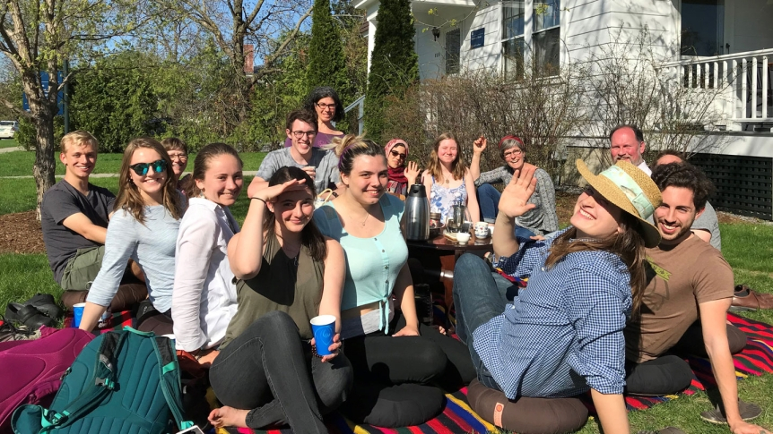 Students and staff gather for tea on the Scott Center lawn.