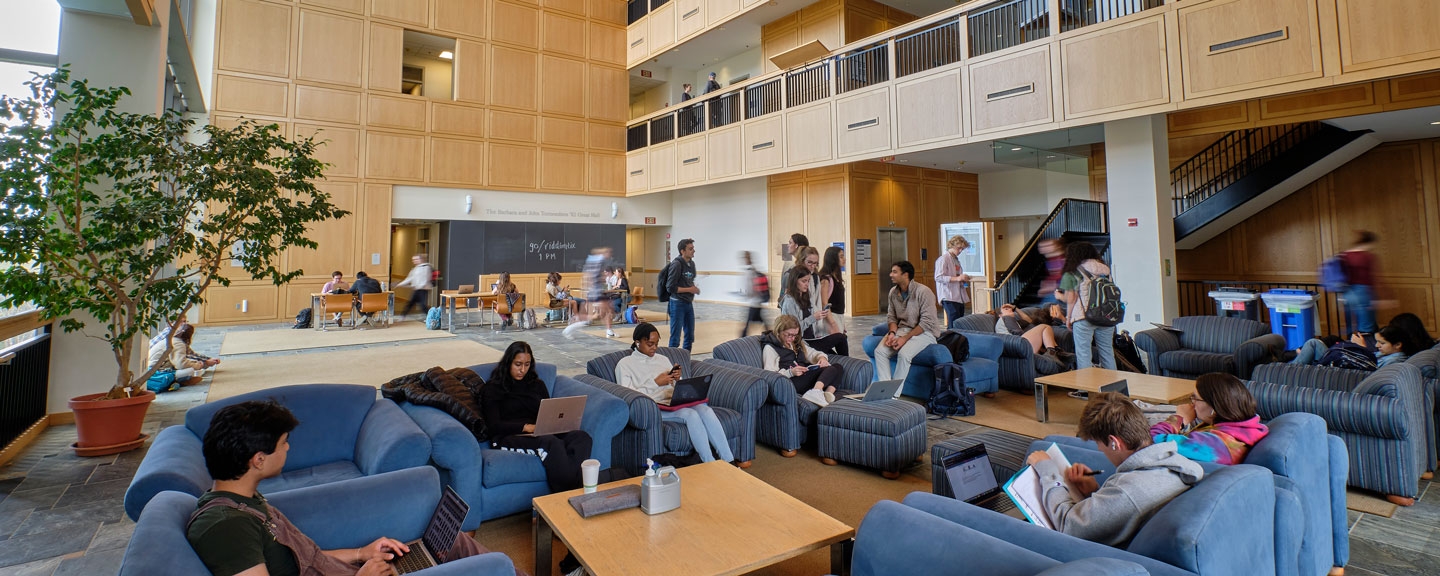 Wide view of students coming and going in BiCentennial Hall.
