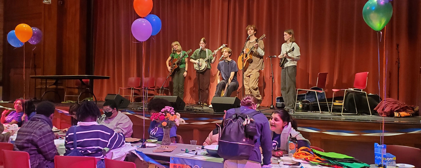A student band performs on stage.
