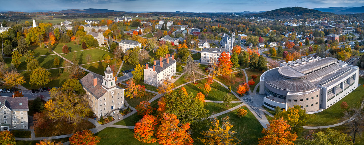 Aerial view of the college campus with the Green Mountains of Vermont in the background.