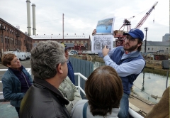 Photo of Andrew Gustafson giving a tour to a group of people