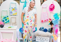 Photo of Jack Reed in front of various items in their studio