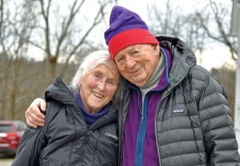 Portrait of Victor and Betty Nuovo embracing one another in winter clothes and looking into the camera