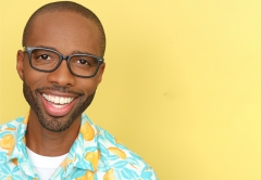 Portrait of Middlebury Alum Damien Washington on a yellow background