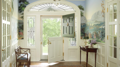 airy white foyer with landscape wallpaper