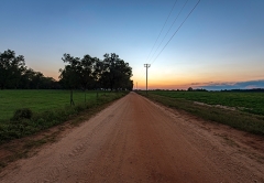 Vermont dirst road at sunset with mountains