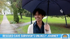 Adul Samon ’27 holding an umbrella on the Middlebury Campus