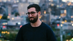 portrait of Brad Becker-Parton with LA cityscape in the background.