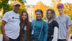 Family poses together during Fall Family Weekend