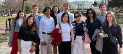 A group of Middlebury student pose in front of the White House in Washington, DC.