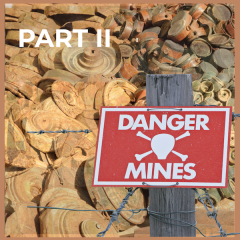 Danger sign in front of landmines