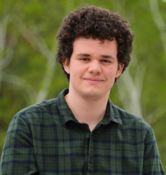 Nicolas portrait with trees in background