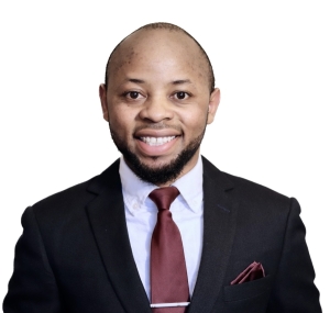 Headshot of Bienfait Hahozi Mugenza wearing a black suit jacket, white shirt, and red tie in front of a white background.