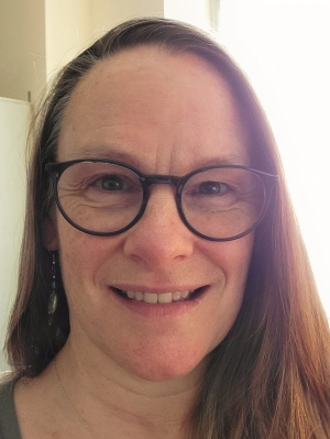 Engvall smiling with glasses
