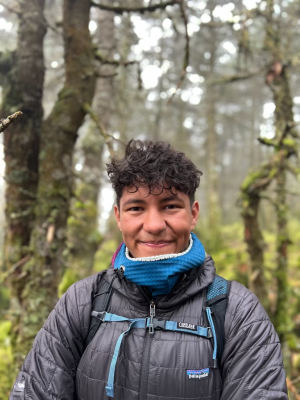 Andrés Oyaga standing in a forest