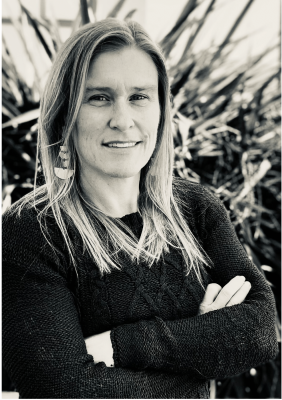 Sarah Jaquette Ray standing in front of plant
