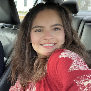 smiling person seated in car