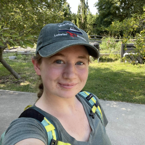 person wearing a hat looking at camera