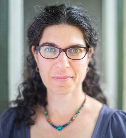 Rabbi Danielle Stillman wearing a turquoise necklace and blue blouse