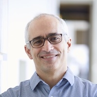 Smiling man in a blue dress shirt