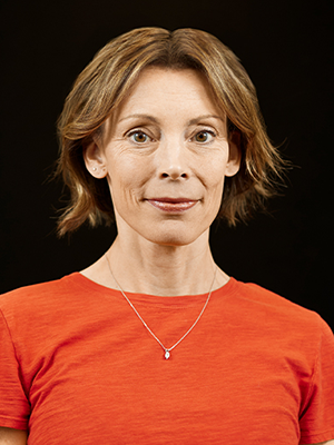 Headshot of Darcy Morter in burnt orange top