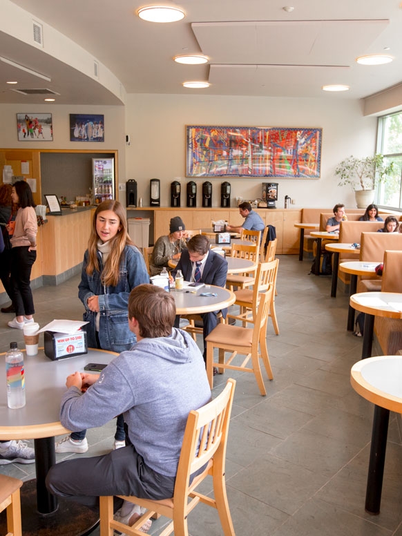 Students relaxing with coffee at Wilson Cafe.