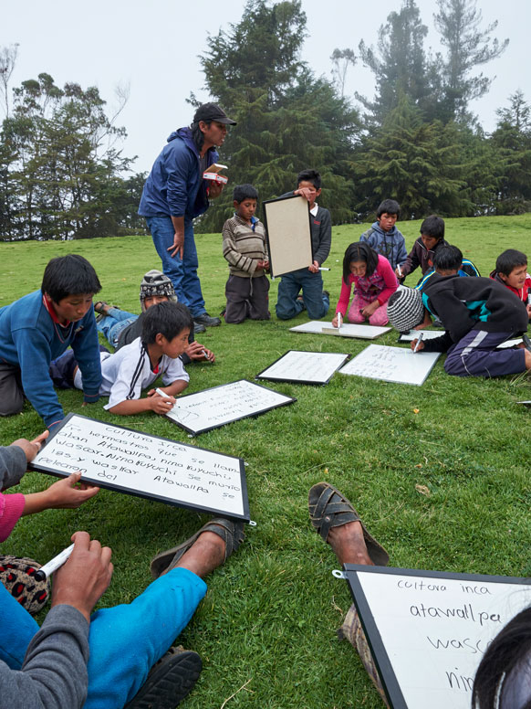 Elementary students outside working.