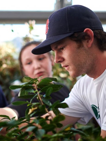 Students working in the college greenhouse.