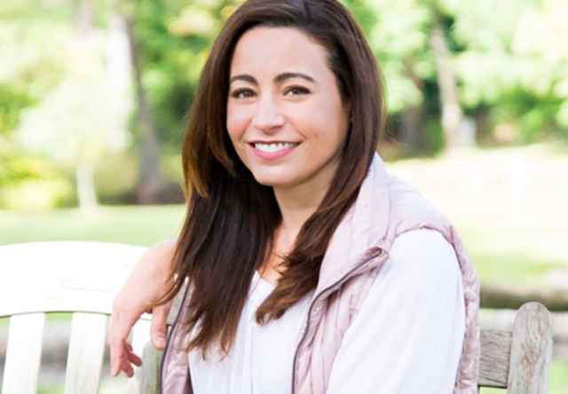 Portrait of Nancy Zagami-Hunt sitting outside on a bench