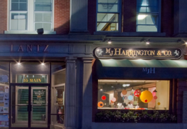 Storefront for a jewelry store with green awning