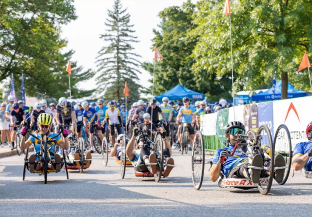 Photo of people racing with handcycles in the annual Kelly Brush Ride