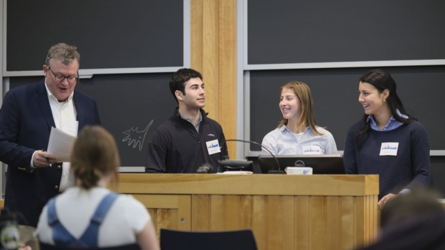 Students present at podium