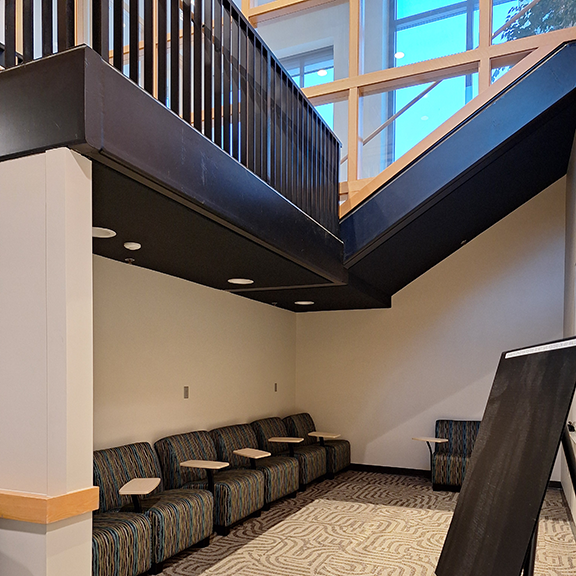 Soft chairs with desks in a nook