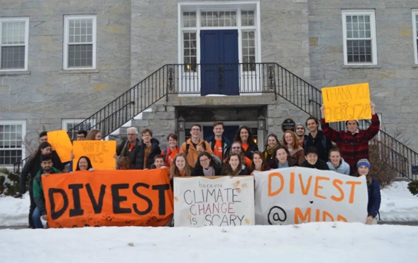 Divest Middlebury activists gather outside a Board of Trustees meeting to show their support for divestment.