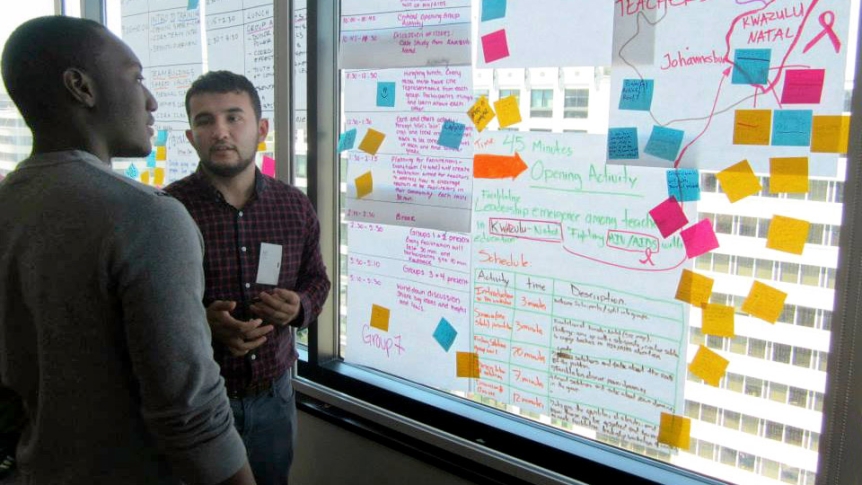 Two students discuss a research project in the Middlebury DLINQ offices.