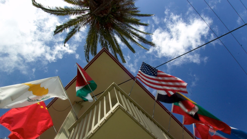 Looking up at the flags that surround the entrance to the Middlebury Institute of International Studies.