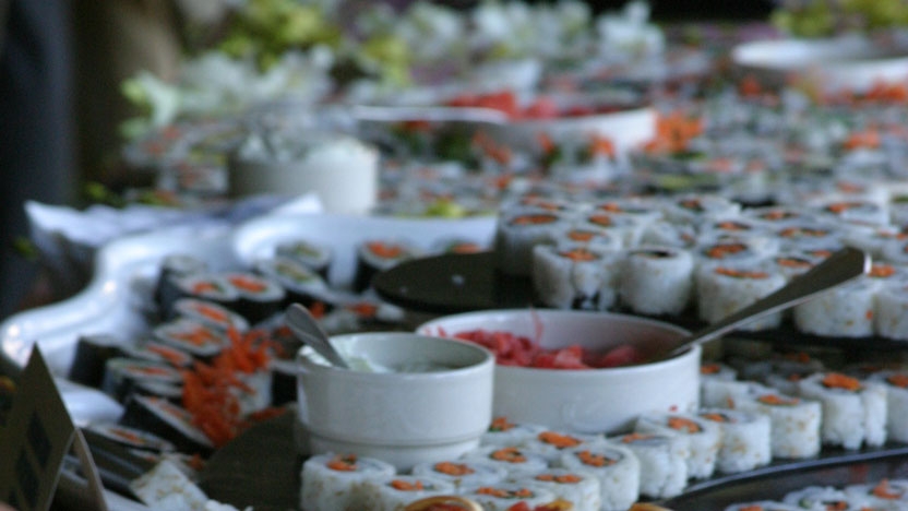 A beautiful table spread with food from catering services.