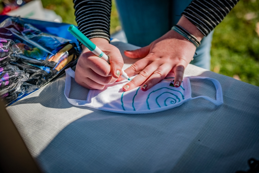 Decorating a mask on Vermont Mask Day
