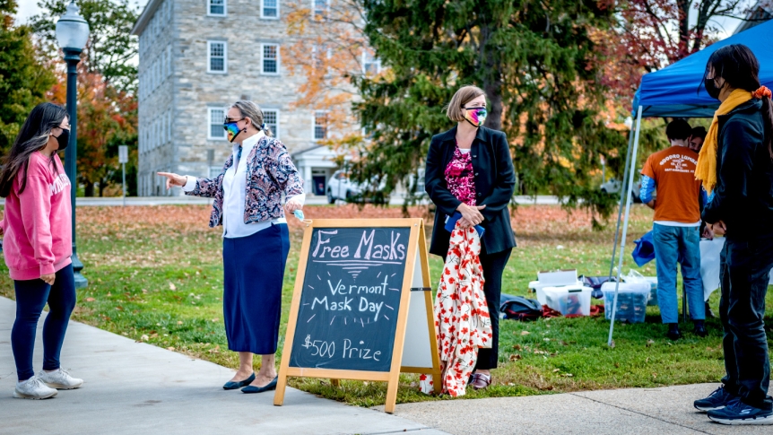 Middlebury President Laurie Patton wears a mask and interacts with students on Vermont Mask Day.