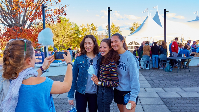 Four Middlebury students take photos at Harvest Fest