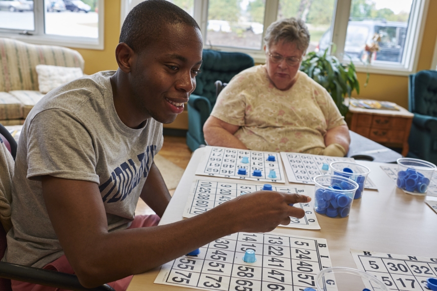 Student working with community member