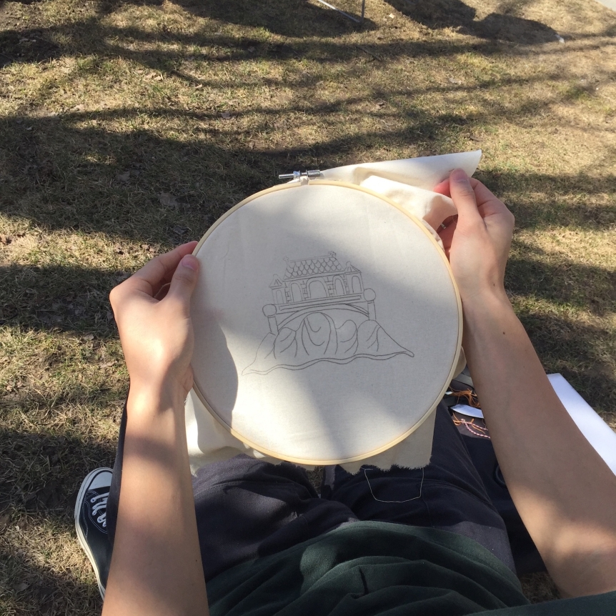 student doing embroidery