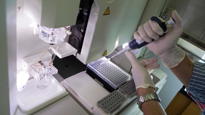 A student uses the lab equipment to test information for a research project.