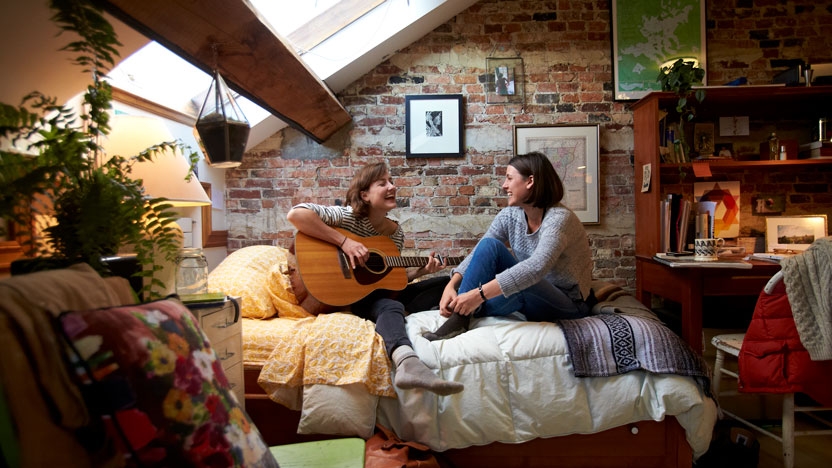 Students hanging out in a comfortable dorm room.