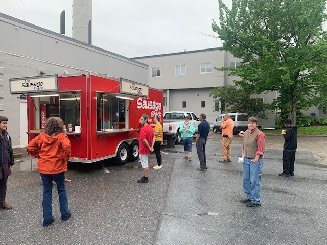 Employees wait in line for their breakfast sandwiches.